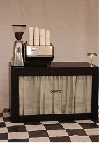 Belong coffee cart on a checkered floor